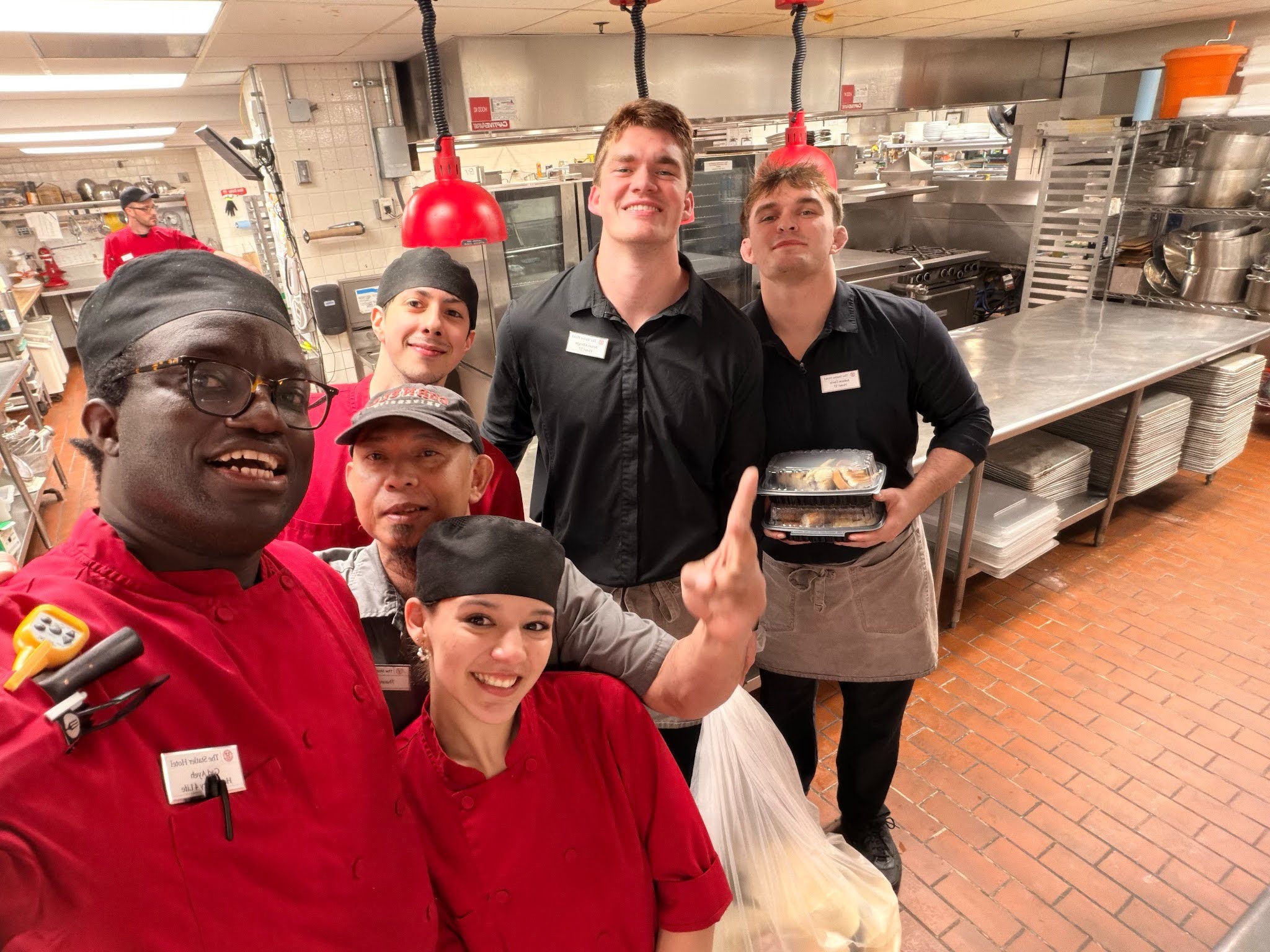 Julia with her back-of-house team in a hotel kitchen at Cornell